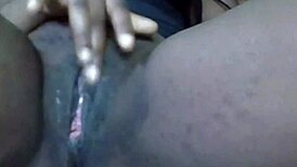 cyndy blackslave enjoys a close-up cam session with cum on her shaved pussy