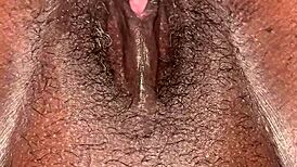 pretty ebony woman displays her tits and pussy for the camera