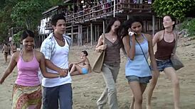 Croc sexy bikini girl posing on the beach with a playful twist