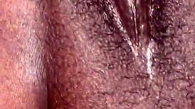 pretty ebony woman displays her tits and pussy for the camera