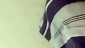 sexy couple lounging in bed sharing laughs and cuddles with soft music playing in the background