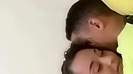 sexy couple lounging in bed sharing laughs and cuddles with soft music playing in the background