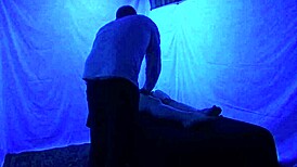 Gigi breeze receives detailed blacklight massage with fetish elements from black masseur