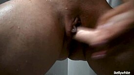 This beautiful amateur girl is masturbating in the shower