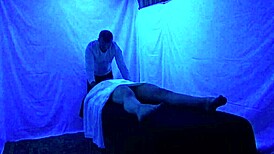Gigi breeze receives detailed blacklight massage with fetish elements from black masseur