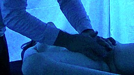 Gigi breeze receives detailed blacklight massage with fetish elements from black masseur