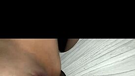 Eagerly sucking massive cock through the gloryhole setup