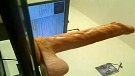 Blonde deep throats huge dildo in hardcore action
