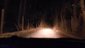 A Couple's Outdoor Adventure In The Mountain At Night