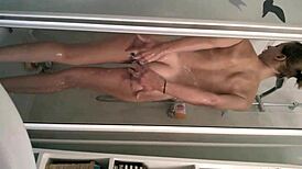 the sexy teen girl steps into the shower, feeling the warm water