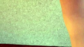 Watch her strip naked and tease her shaved pussy.