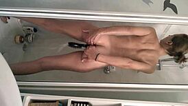 the sexy teen girl steps into the shower, feeling the warm water