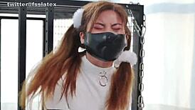 asian woman trapped in latex catsuit straitjacket bondage