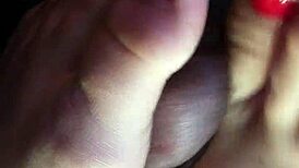 My friend gives an amazing footjob in the car, leading to cum