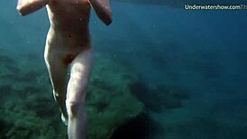 hot ginger swims underwater in tenerife pool