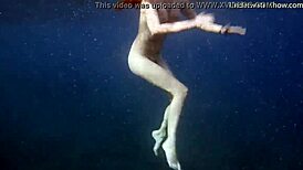 hot ginger swims underwater in tenerife pool