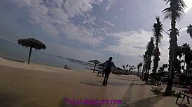 she walks along the boardwalk, showing off her ass, and ends up getting fucked doggystyle outdoors