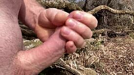 Cumming Hard by the River with a Curved Upwards Cock