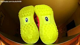 Tall girl shows sexy barefoot feet in Nike shoes for foot fetish domination