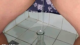 my shaved pussy pissing hard into a bottle feels so wild
