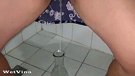 my shaved pussy pissing hard into a bottle feels so wild