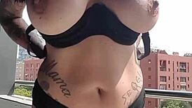 Neighbors spy on this milf masturbating her big tits in a voyeur fetish