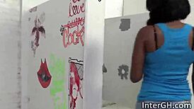 Ebony deepthroats cock at glory hole!