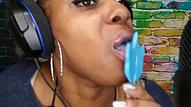 Horny ebony freak sucking lollipop with fetish passion