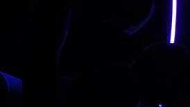Carrie B indulging in blacklight sex with small tits.