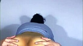 art student shows work to male friend in apartment