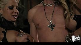 hey, those tattooed goth girls are sharing a huge cock in this threesome, licking and sucking like crazy