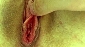 young woman achieves orgasm through clitoral stimulation at home