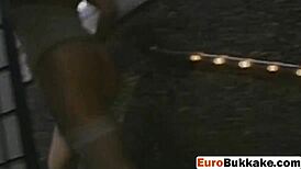 European Woman Surrounded by Group in Public