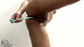 asian amateur girl stuffs her pussy with toothbrush during shower 😏