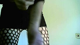 Transsexual crossdresser in black boots showing off shemale features