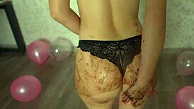 young girl crushes cake with butt