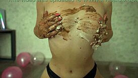 young girl crushes cake with butt