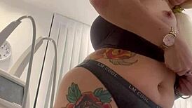 Blonde Tattoo Tease Removing Clothes