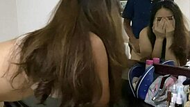 Beautiful Thai girl poses in mirror