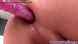 this tranny babe chills in lingerie, dildoing herself solo with toys, getting all worked up