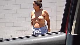 Mary Cadelona shows off topless in car through Campinas-SP streets.