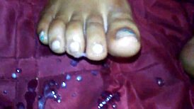 Ebony foot job with cumshot on feet