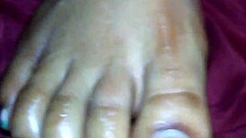 Ebony foot job with cumshot on feet