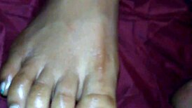 Ebony foot job with cumshot on feet