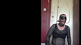 blindfolded sissy crossdresser swallows piss through gag, anal hooked