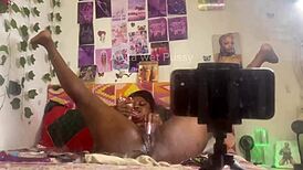 She masturbates alone with a dildo, fingering her pussy while bent over in front of the mirror.