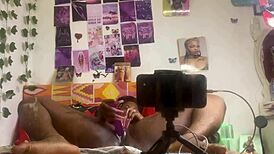 She masturbates alone with a dildo, fingering her pussy while bent over in front of the mirror.