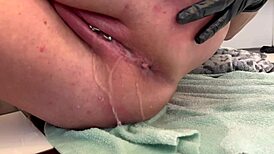 european housewife fingers her asshole with three gloves, gaping it wide, and pees at the end