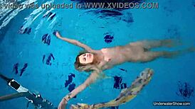 Petite teen Milana Voda braves naked underwater swim session