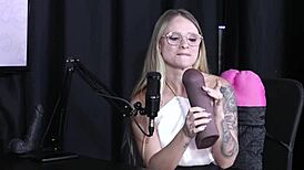 Naty Varga in sheer red lingerie attempts a sensual blowjob on a massive cock.